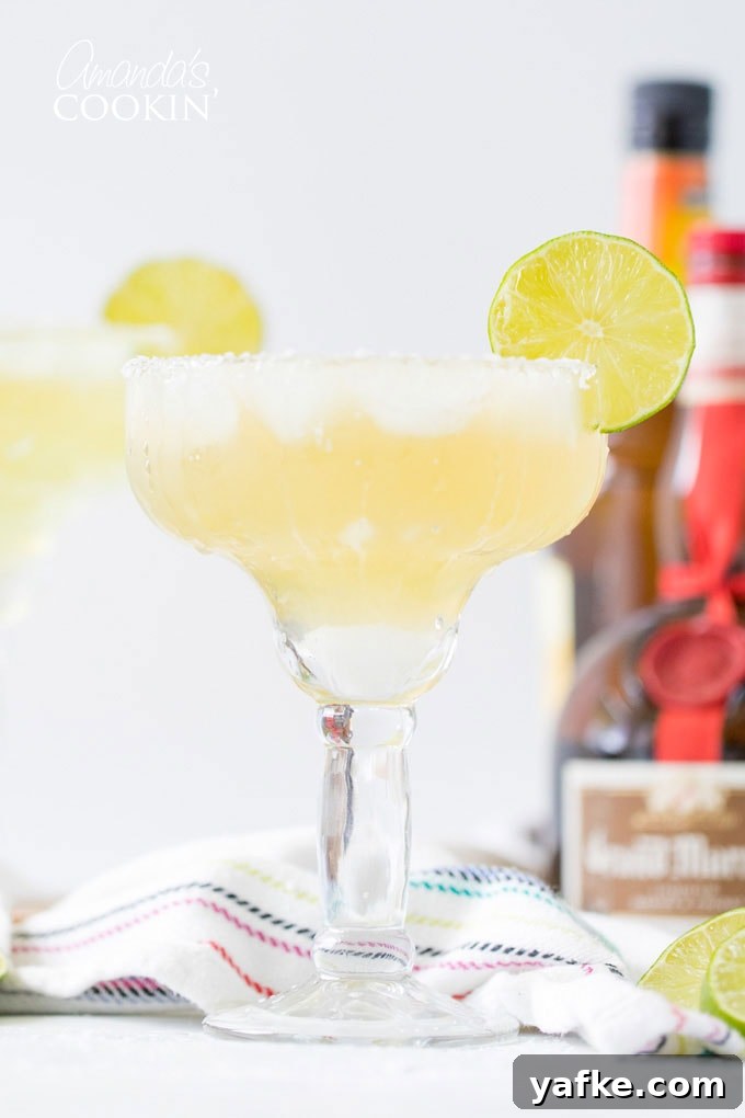 Classic margarita on the rocks with lime garnish. margarita on the rocks in a glass with a lime garnish
