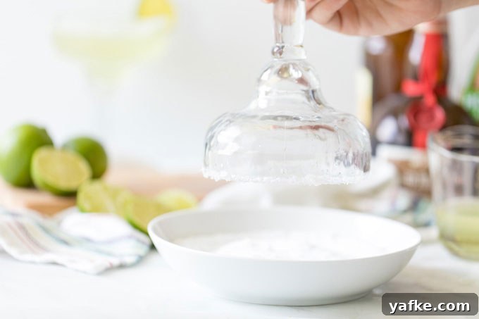Classic Margarita Cocktail: Recipe, Tips and Variations 4 dipping rim of glass into salt