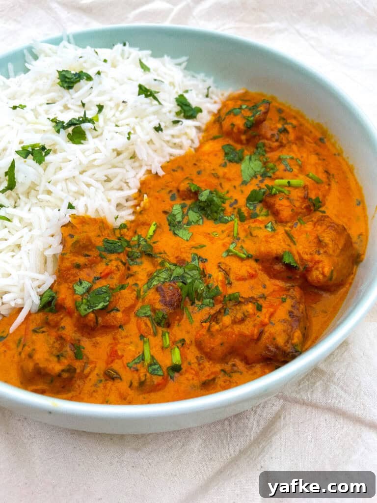 30-Minute Butter Chicken Recipe: Creamy Indian Curry 2 A bowl of white rice and butter chicken