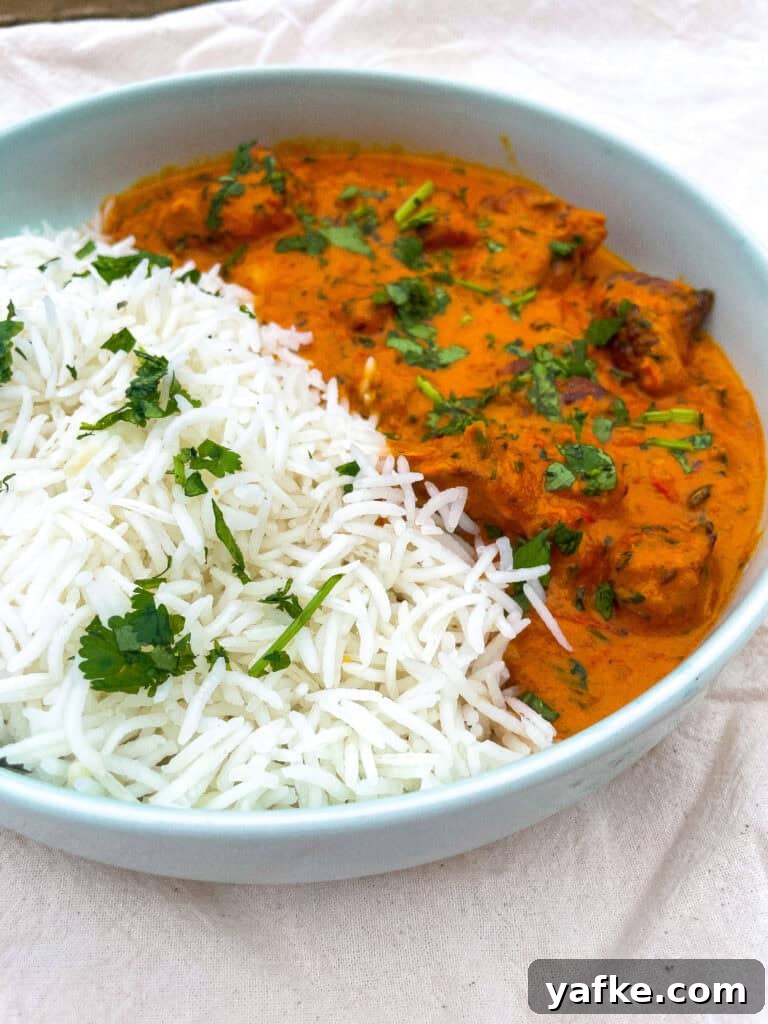 30-Minute Butter Chicken Recipe: Creamy Indian Curry 7 a bowl of butter chicken and white rice