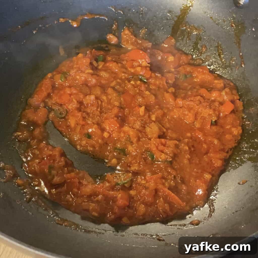 30-Minute Butter Chicken Recipe: Creamy Indian Curry 4 Tomatoes and water have been added to the pan