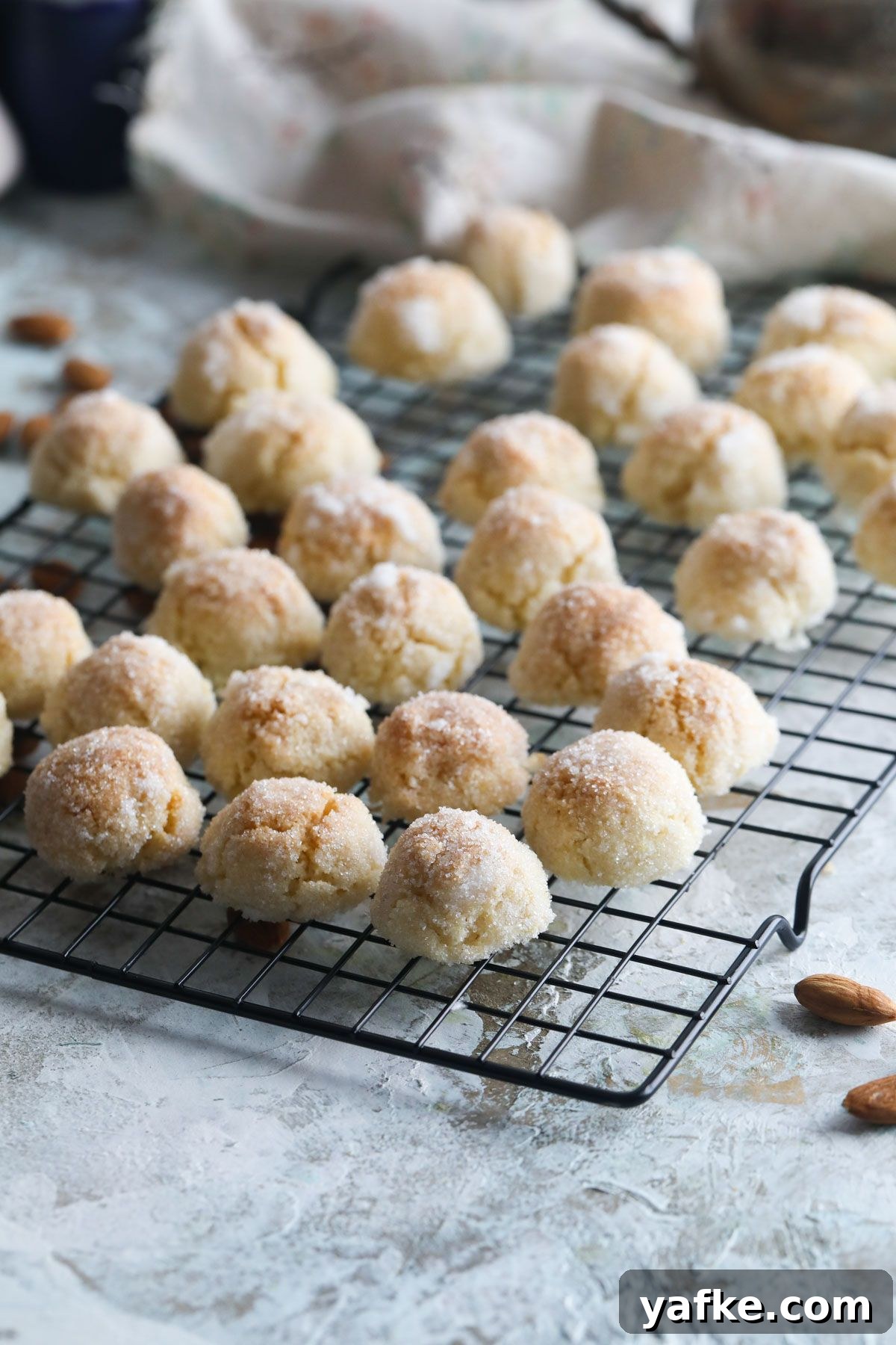 Crispy Almond Amaretti Cookies Recipe 2 Amaretti cookies on a tray