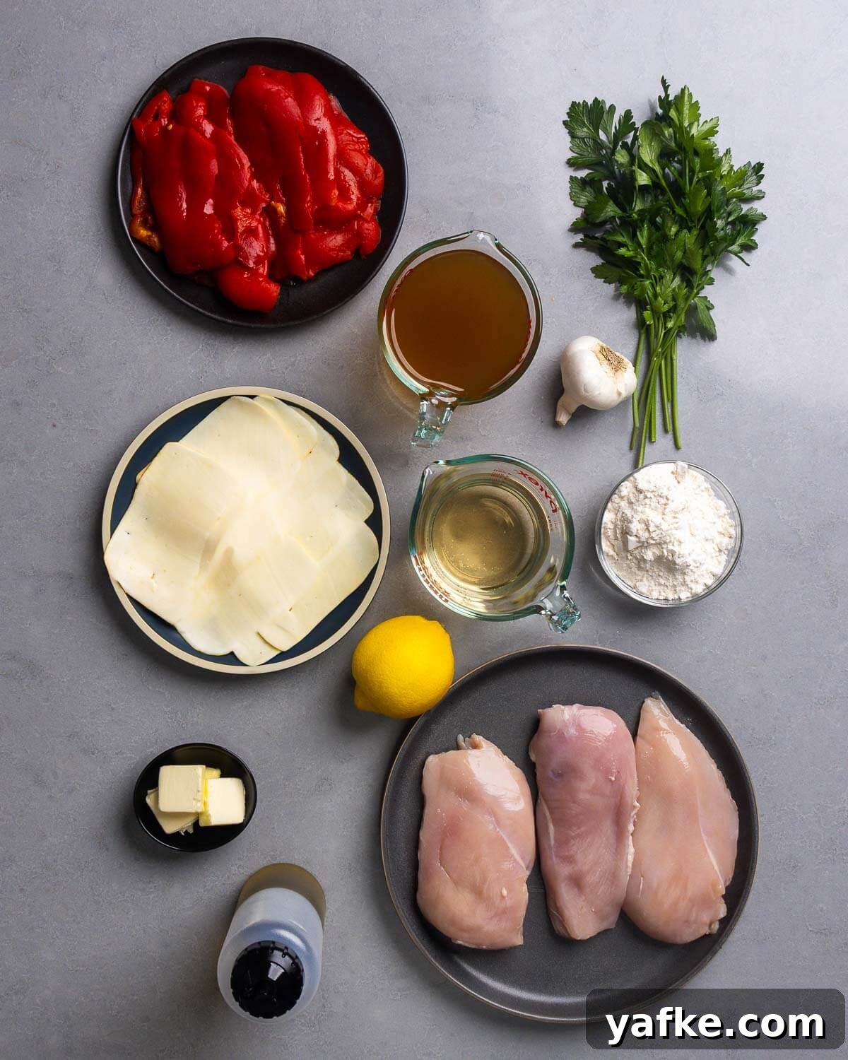 Roasted Red Pepper Chicken with Melted Mozzarella 4 Ingredients shown: red roasted peppers, chicken stock, parsley, garlic, mozzarella, lemon, white wine, flour, butter, olive oil, chicken breasts.