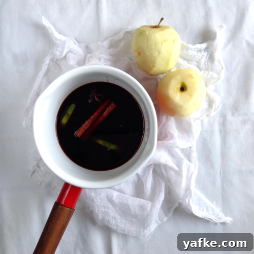 Apples simmering in red wine