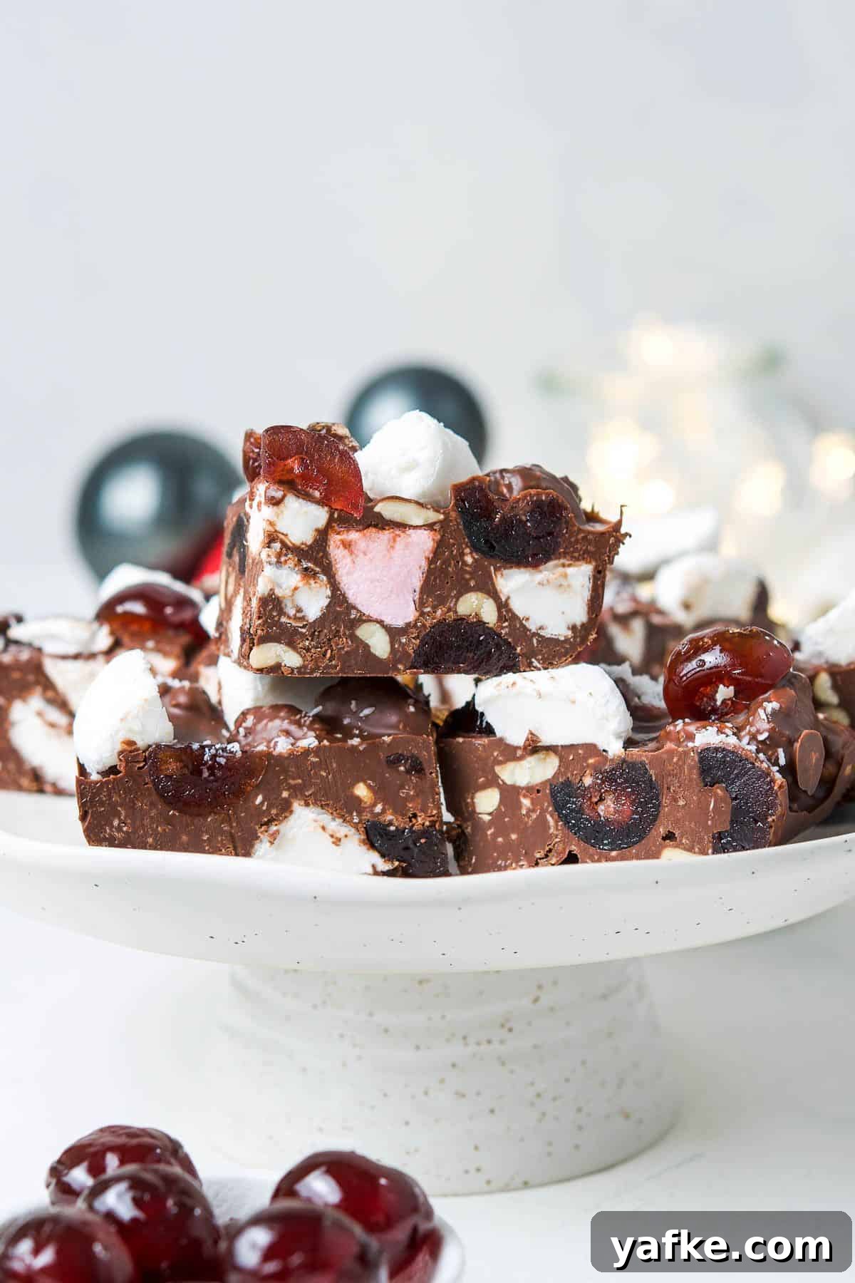 25 Homemade Edible Gift Ideas for Any Occasion 26 Round tall cake stand with cut pieces of Rocky Road
