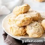 25 Homemade Edible Gift Ideas for Any Occasion 31 Round white plate of almond cookies