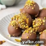 25 Homemade Edible Gift Ideas for Any Occasion 37 Round grey plate topped with Pistachio Truffles