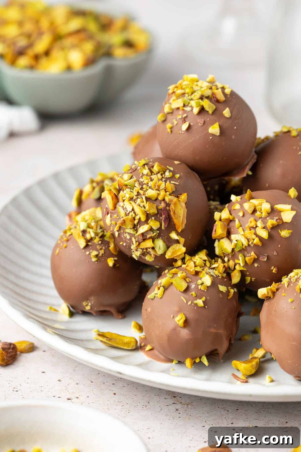 25 Homemade Edible Gift Ideas for Any Occasion 38 Round grey plate topped with Pistachio Truffles