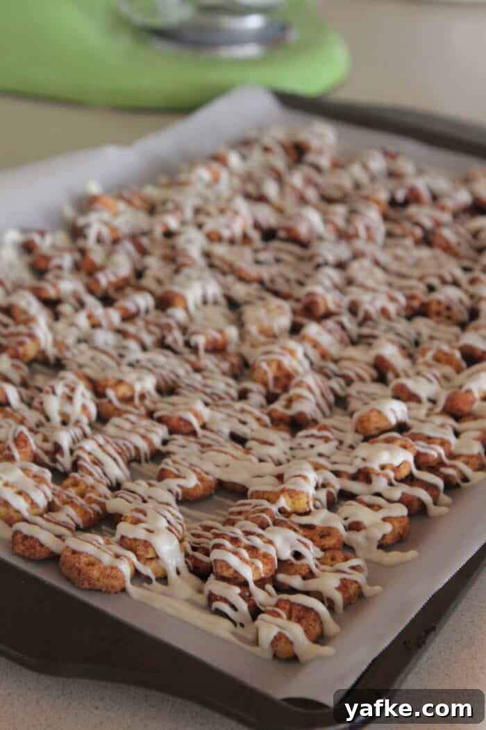 White Chocolate Churro Crunch Snack Mix Recipe 10 white chocolate drizzled over snack mix on baking sheet