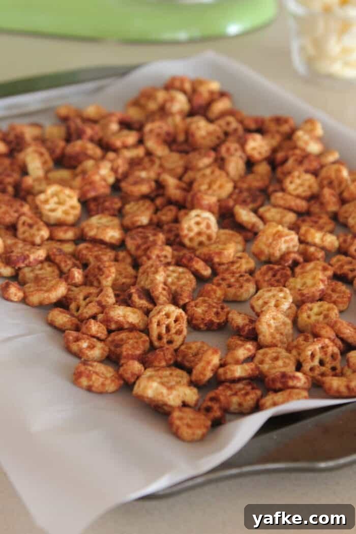 White Chocolate Churro Crunch Snack Mix Recipe 8 snack mix spread onto baking sheet ready to bake