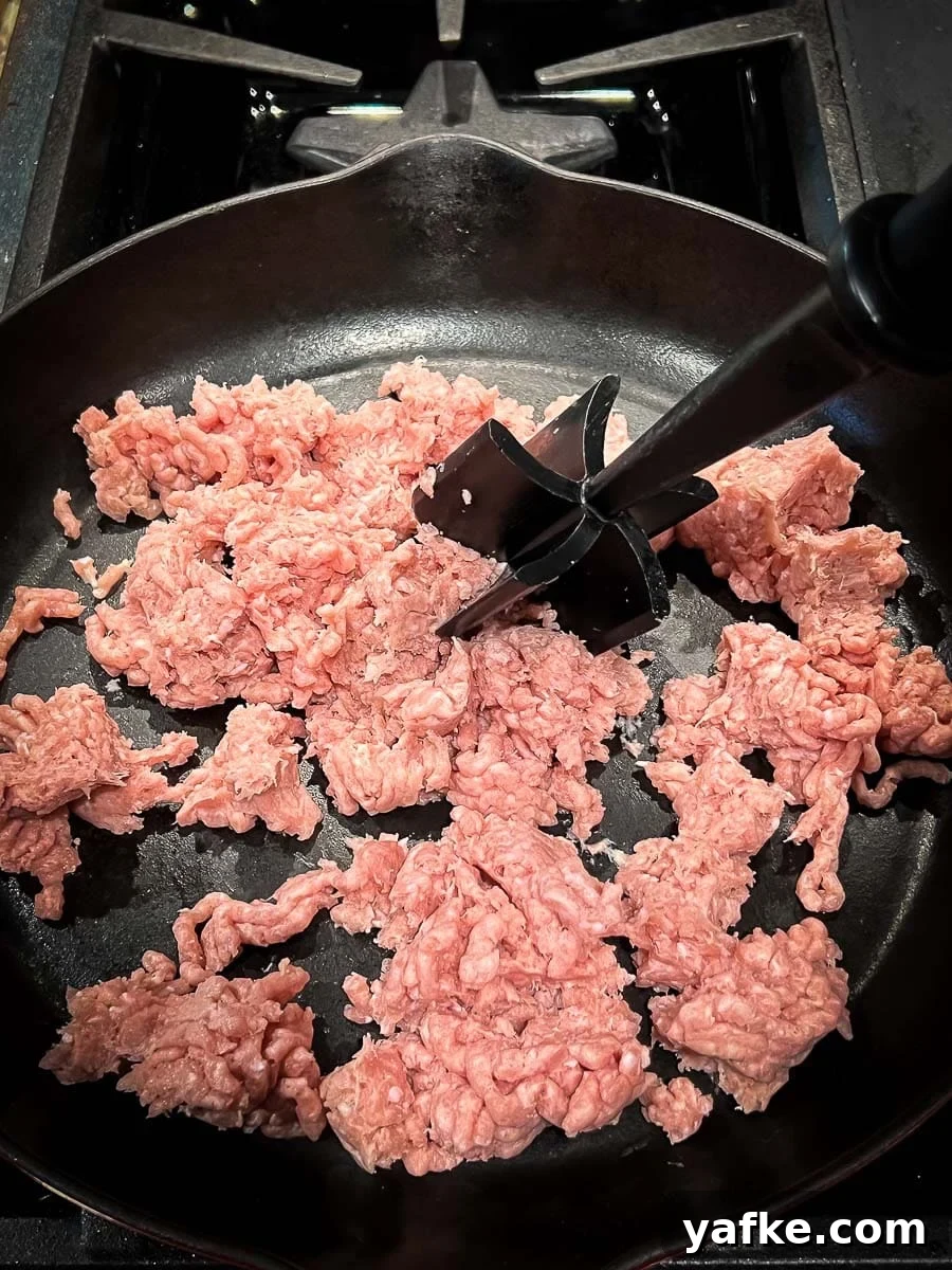 How to Make Homemade Sausage Gravy for Biscuits 3 cooking the ground turkey in cast iron skillet.