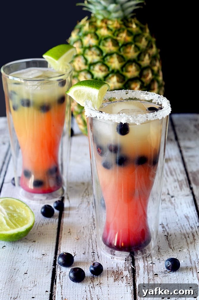 Blueberry Pineapple Margarita Recipe: Tropical Cocktail 2 Blueberry Pineapple Margaritas. A great, fruit-flavored cocktail that's perfect for girls' nights or Cinco de Mayo!