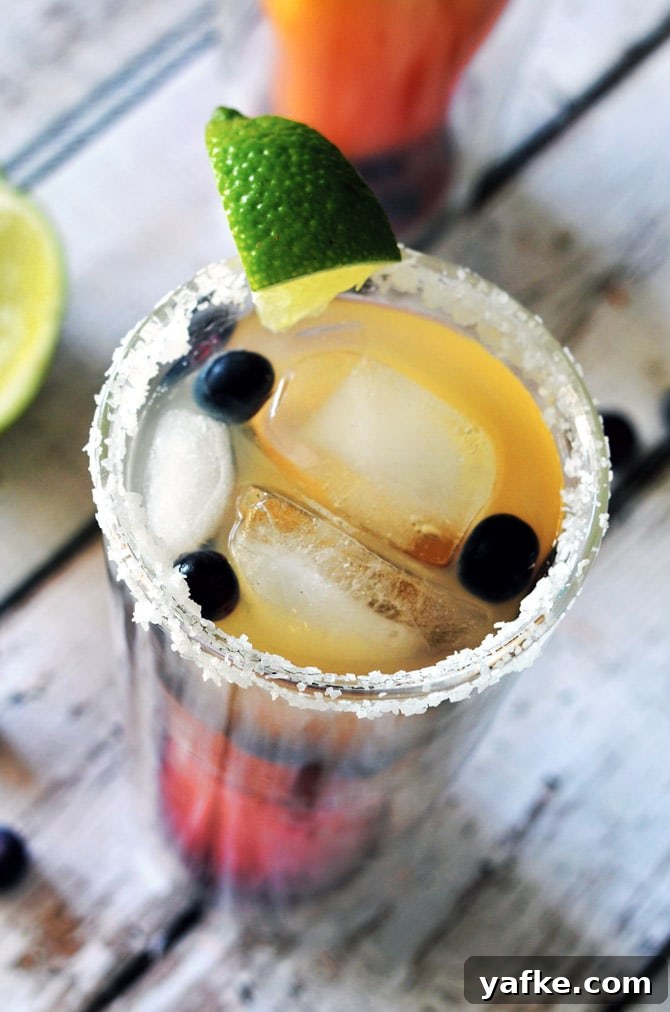 Blueberry Pineapple Margarita Recipe: Tropical Cocktail 5 Blueberry Pineapple Margaritas. A great, fruit-flavored cocktail that's perfect for girls' nights or Cinco de Mayo!