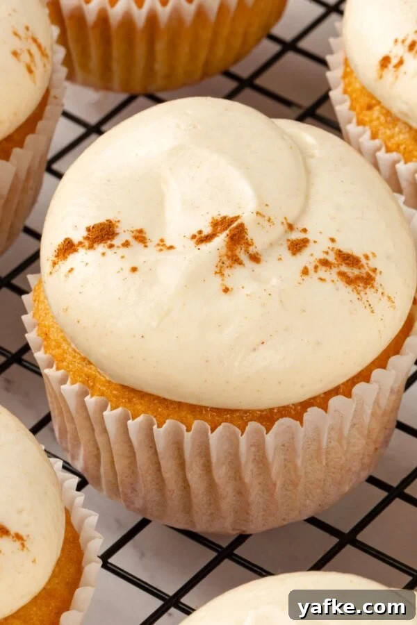 The square crop built for recipe cards featuring pumpkin cupcakes with cream cheese frosting.