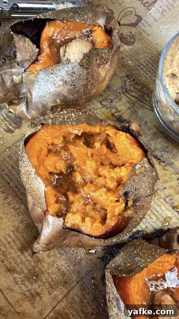 Baked Sweet Potatoes with Savory Maple Butter Recipe 8 Fluffy baked sweet potato split open and fluffed with a fork