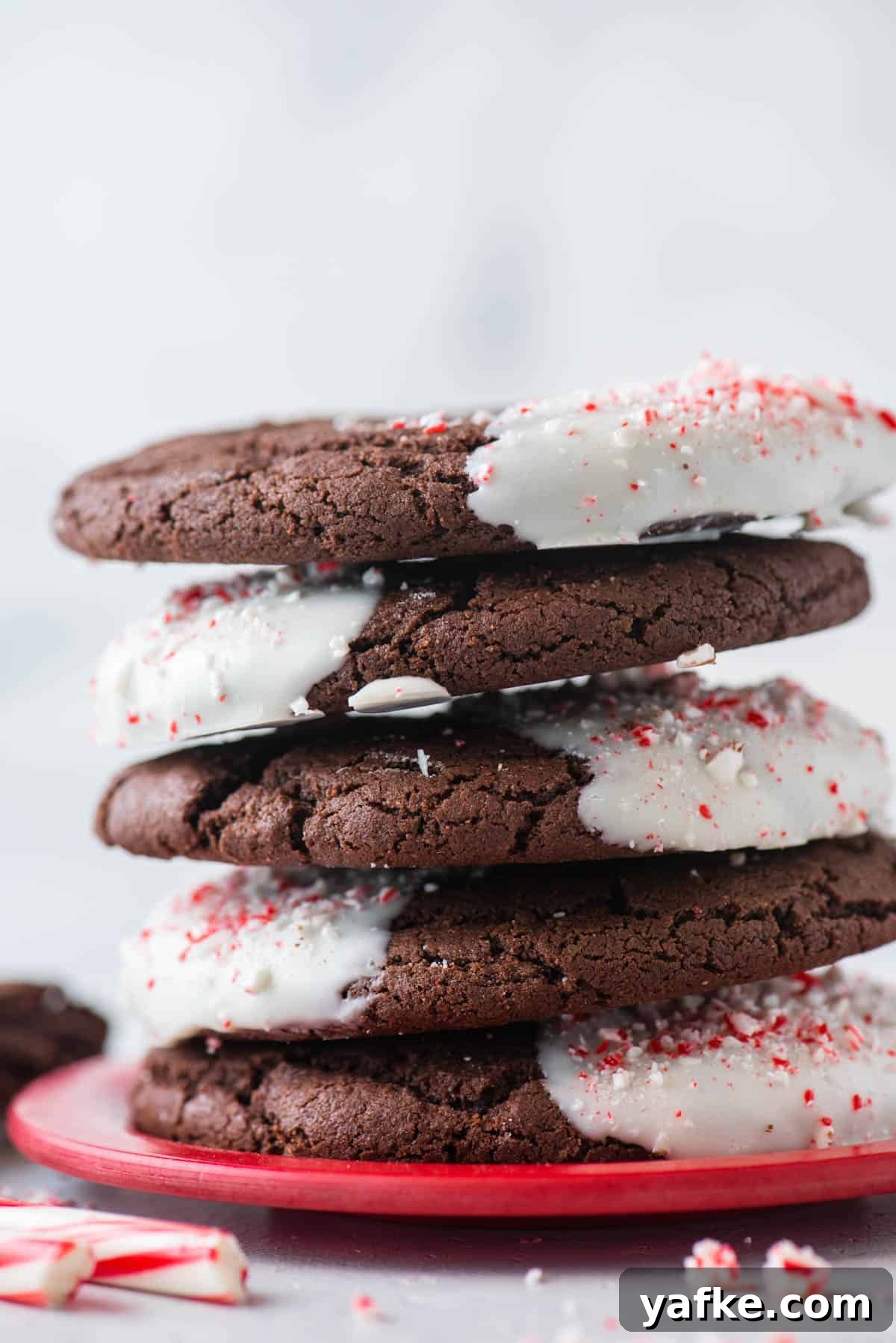 A stack of chocolate candy cane cookies