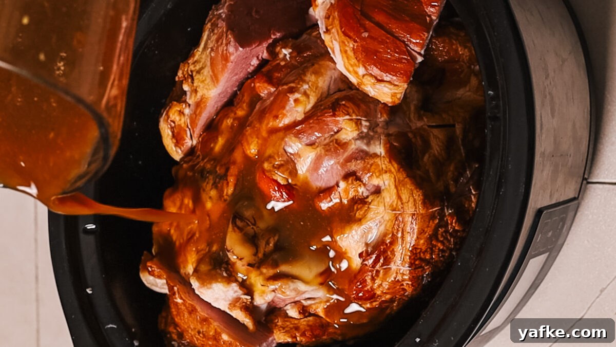Ham Glaze Recipe: Honey Brown Sugar and Mustard 5 Applying glaze to ham