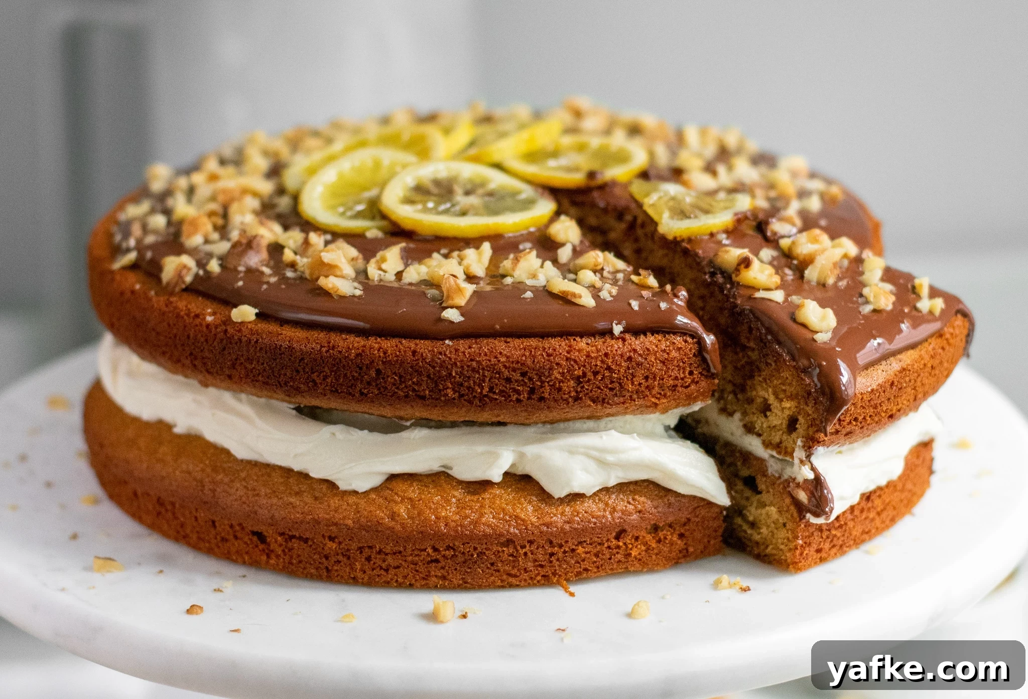 Traditional Danish Honey Cake (Honningkage) Recipe 13 A honey cake with buttercream topped with chocolate, walnuts, and candied lemon.