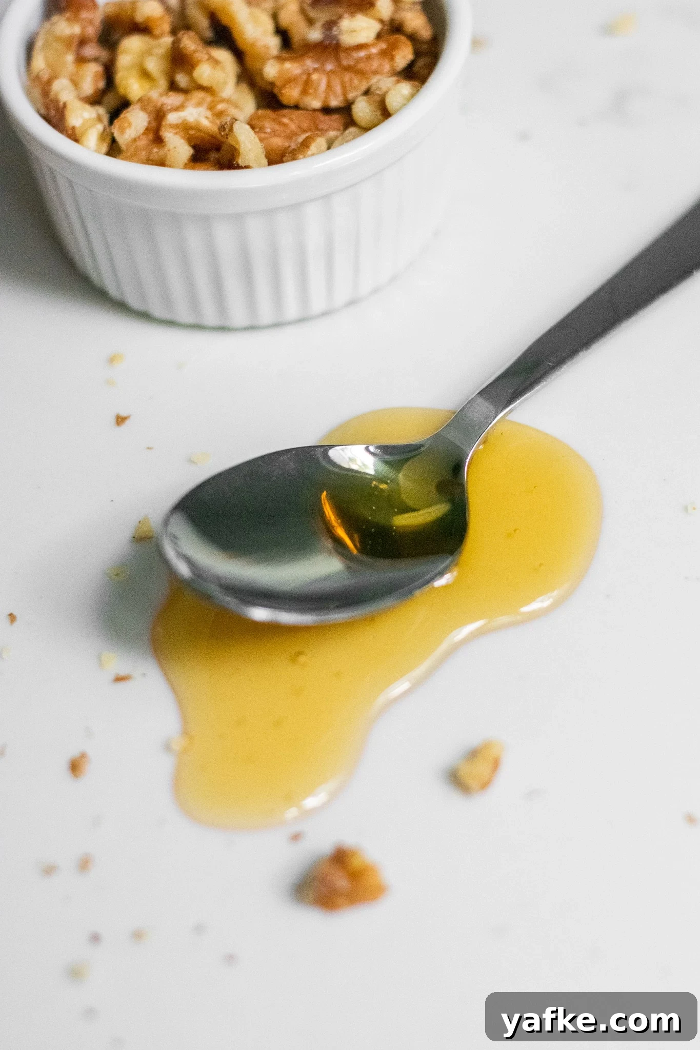Traditional Danish Honey Cake (Honningkage) Recipe 8 A spoon with honey on it.