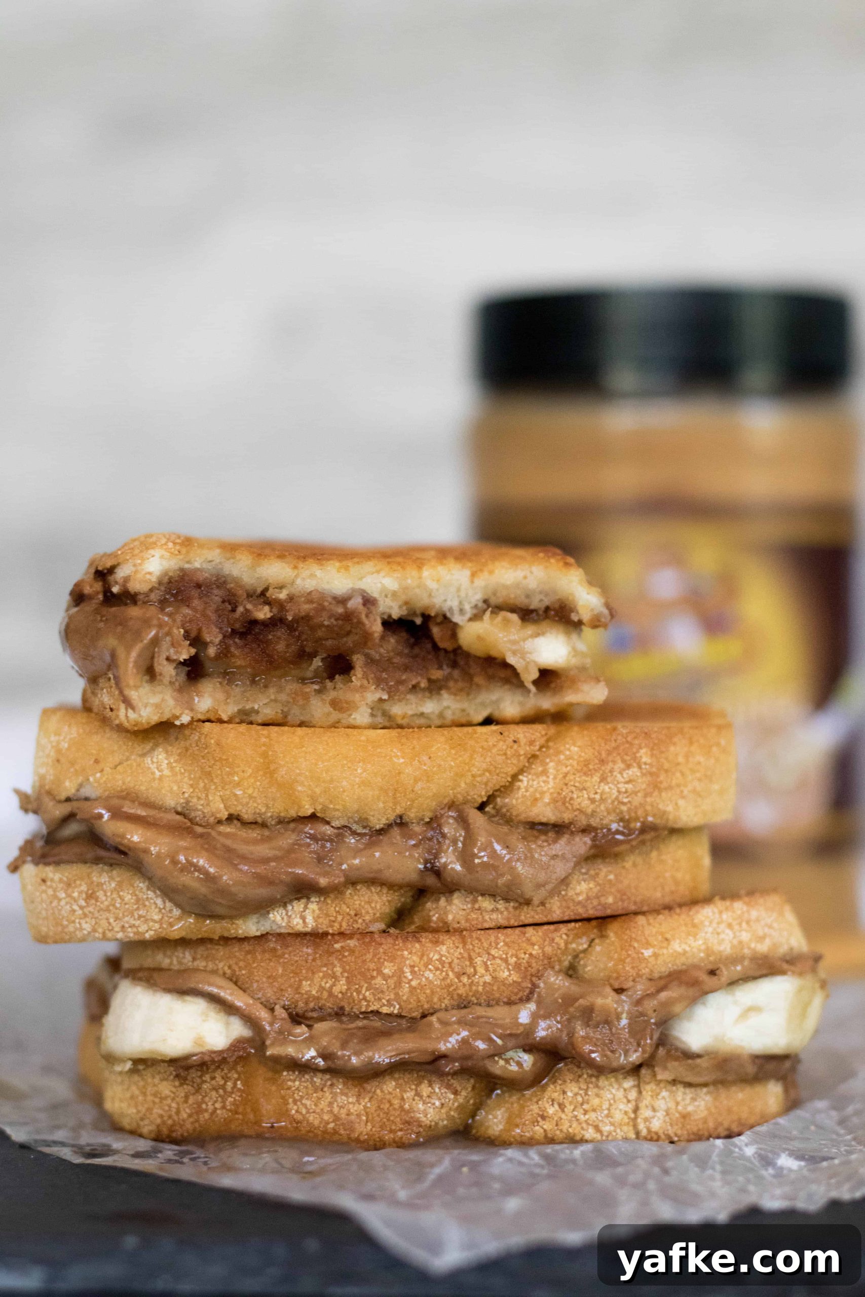 Grilled Peanut Butter and Banana Sandwich Recipe 3 Grilled peanut butter banana sandwich cut in half to show the inside