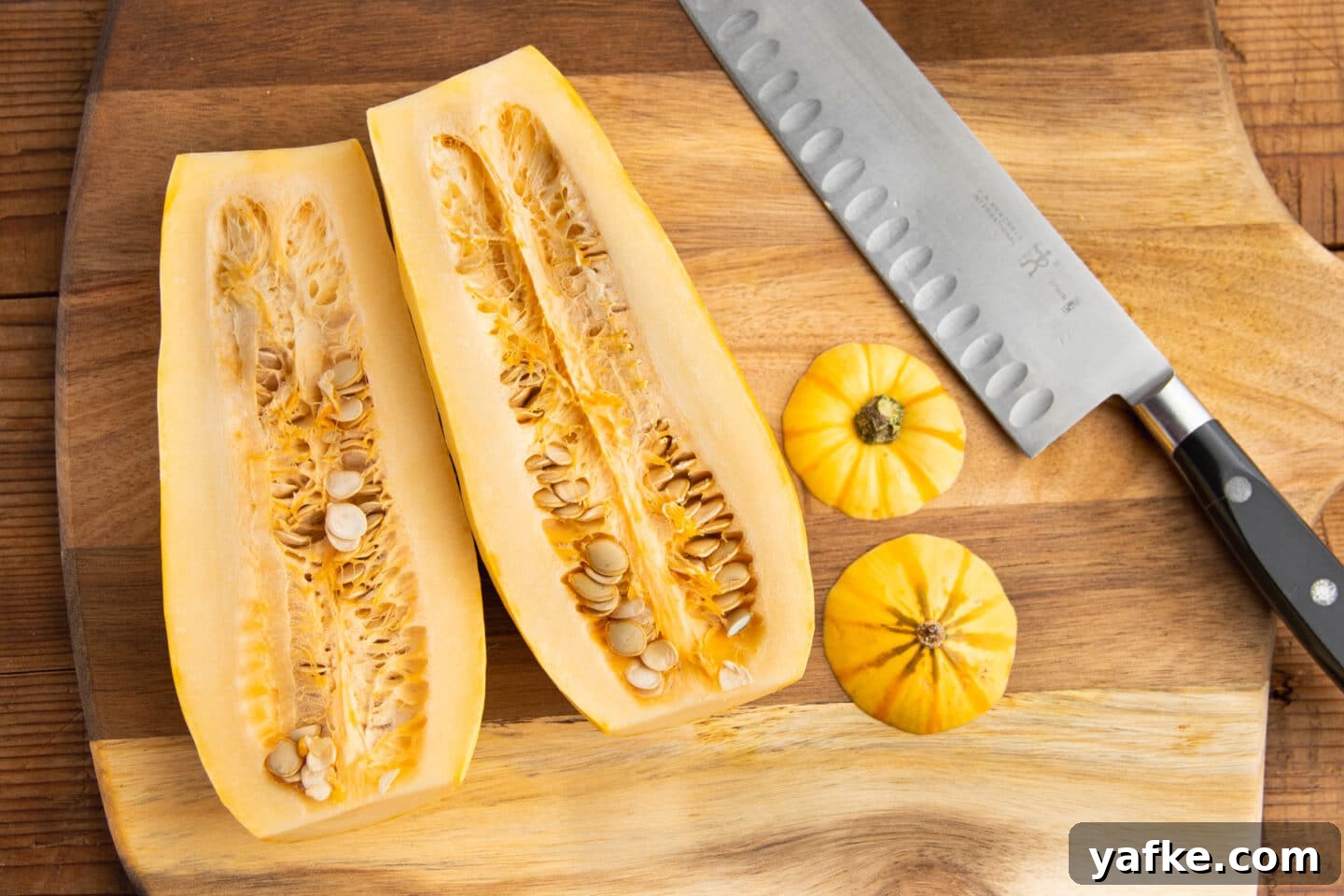 This is a picture of cutting delicata squash in half.