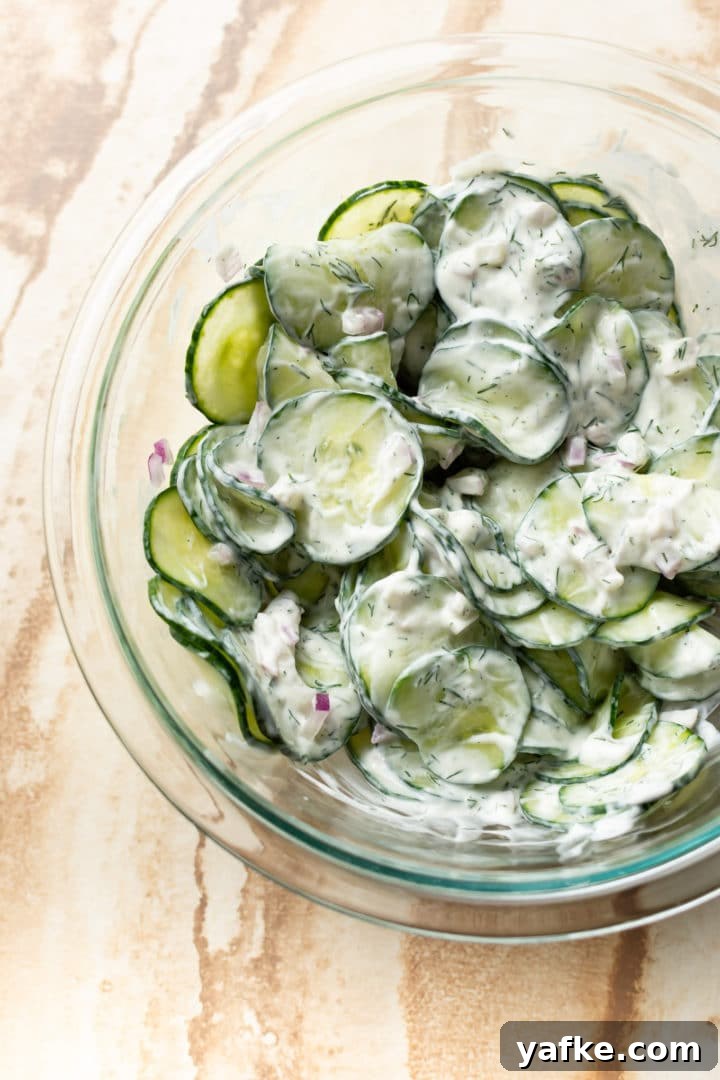 Creamy Cucumber Salad Recipe with Dill and Yogurt 4 creamy cucumber salad in glass prep bowl