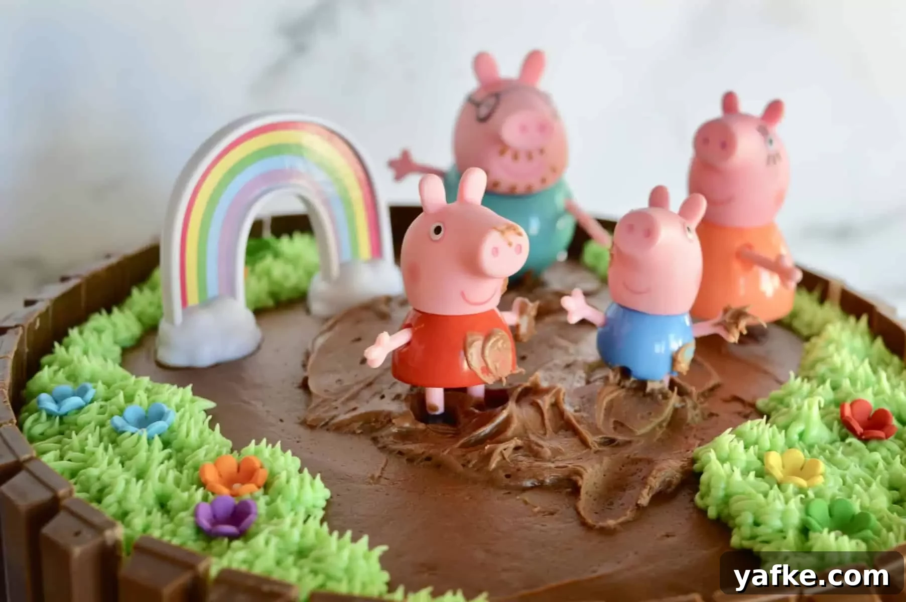 Peppa Pig Kit Kat Birthday Cake Recipe 6 use chocolate frosting to add mud to peppa and George's hands