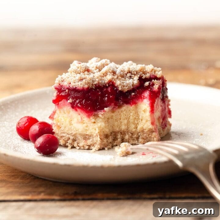 Sliced gluten free cranberry cheesecake bars