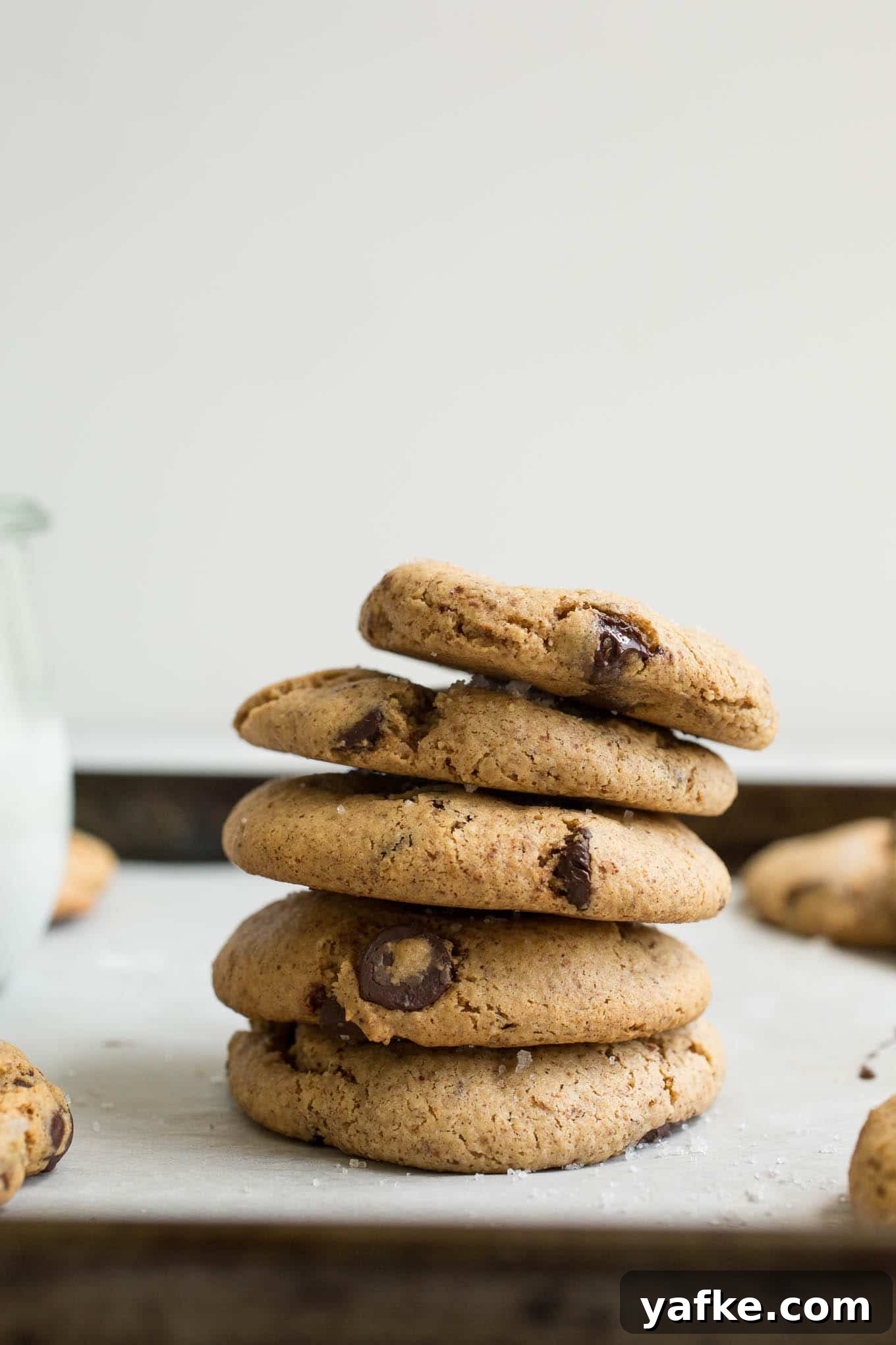 Chewy Almond Butter Chocolate Chip Cookies 7 Cookies stacked on a baking sheet.