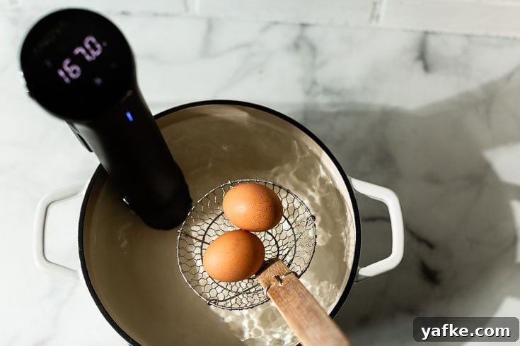 How to Make Silky Sous Vide Poached Eggs 2 sous vide poached eggs in water bath