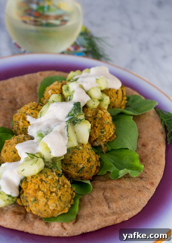 Sweet Potato Falafel Sandwich with cucumber avocado salad and lemon tahini sauce