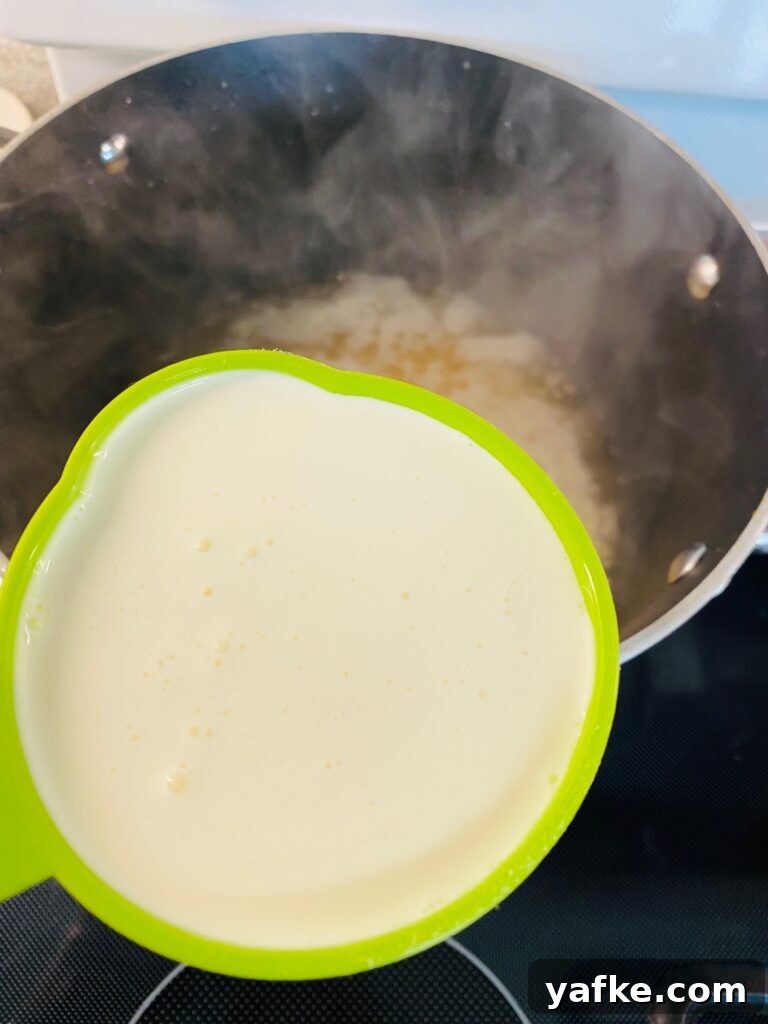 Spicy Buffalo Shrimp over Creamy Cheddar Grits 4 adding heavy cream