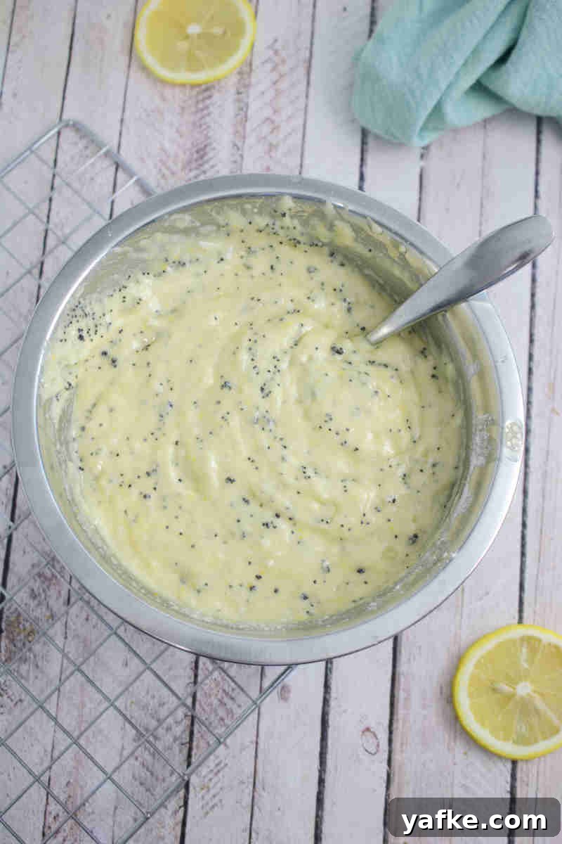 Zesty Gluten Free Lemon Protein Muffins Recipe 6 Bowl with muffin batter.