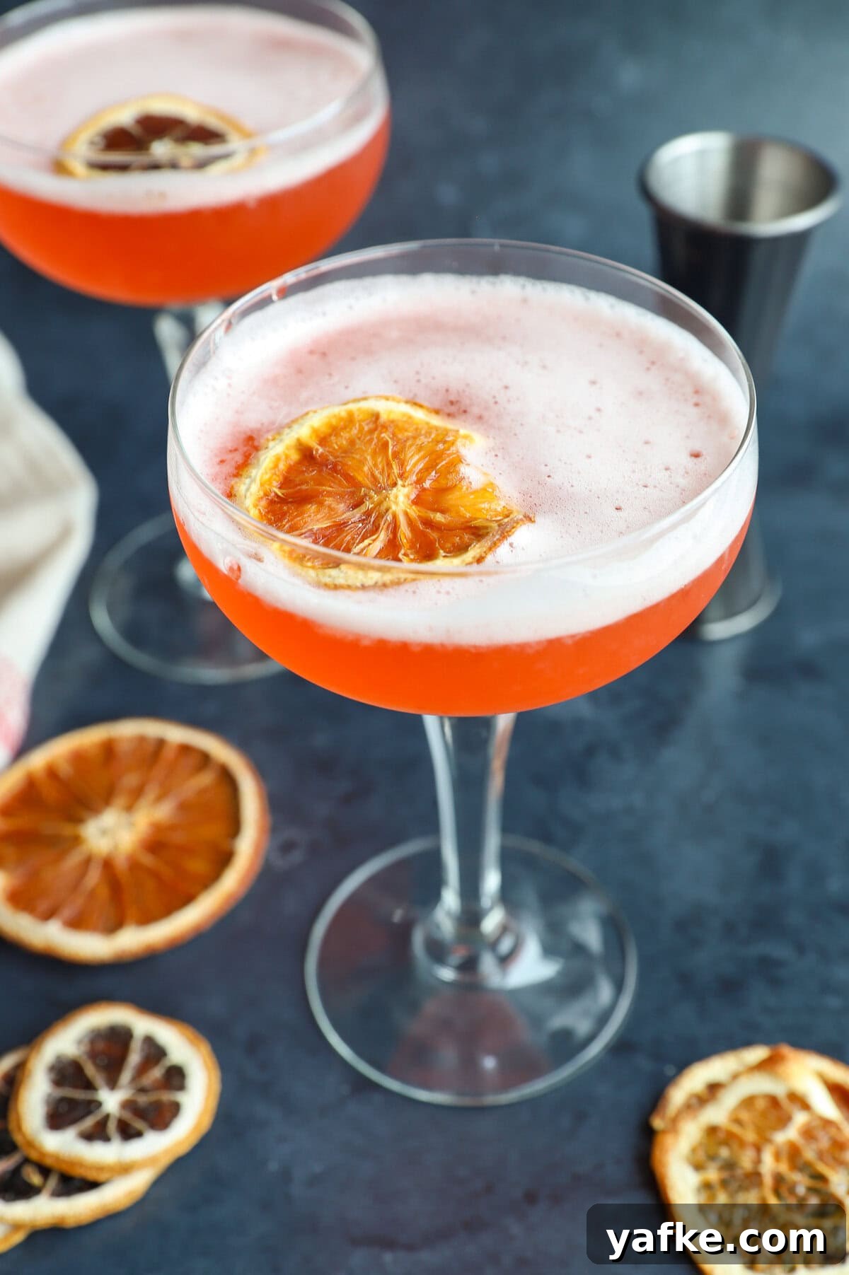 Cocktail with egg white frothy with garnish photo