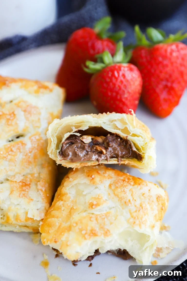 Sweet breakfast chocolate treats on a plate with fresh strawberries