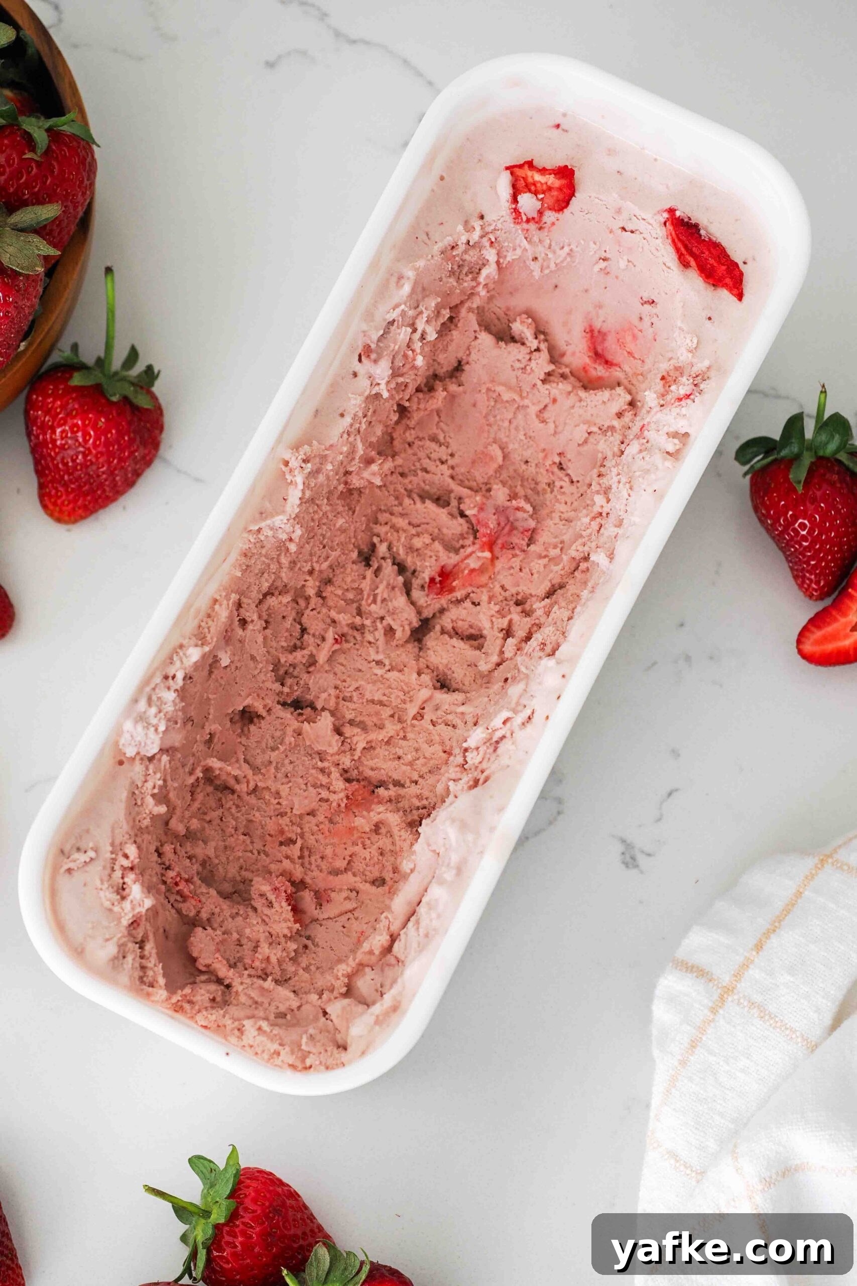 Creamy Homemade Strawberry Ice Cream Recipe 16 Leftover strawberry ice cream in a container.