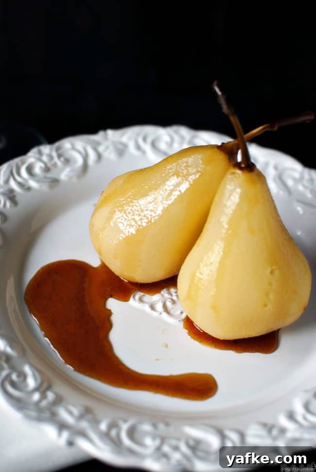 sexy_pears_23 Citrus wine poached pears are a fancy looking dessert that are super easy to make! Bursting with orange flavor and warm fall spices. \\ PassTheSushi.com