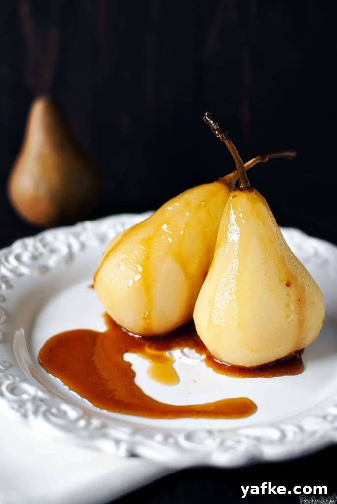 sexy_pears_10 Citrus wine poached pears are a fancy looking dessert that are super easy to make! Bursting with orange flavor and warm fall spices. \\ PassTheSushi.com