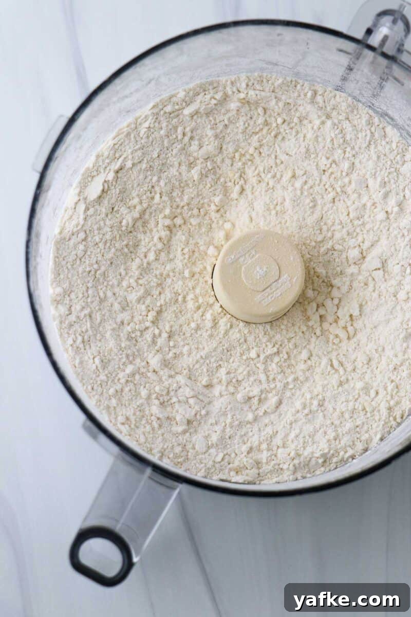 Vaniljhjärtan: Buttery Swedish Custard Heart Cookies 6 Flour and butter mixture in a food processor.