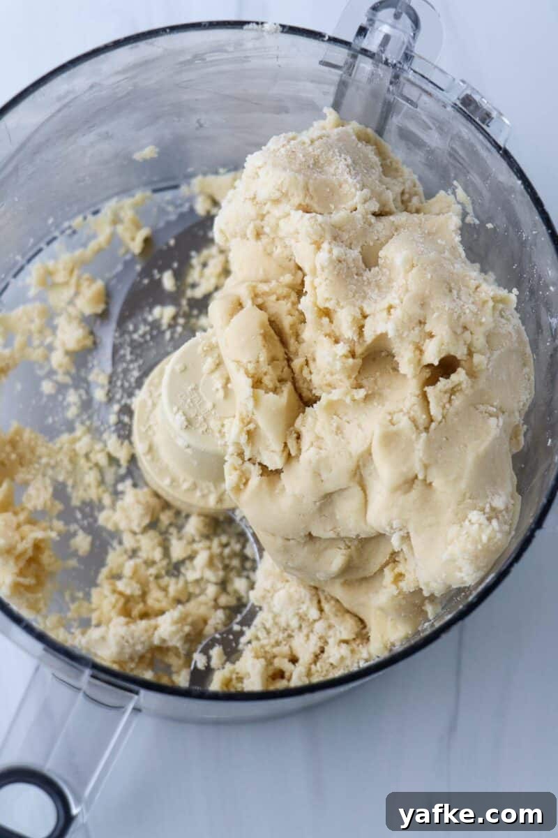 Vaniljhjärtan: Buttery Swedish Custard Heart Cookies 7 Pastry dough in the work bowl of a food processor.