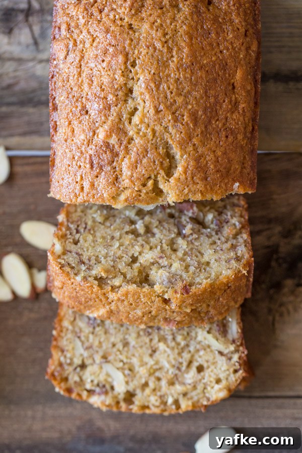 Moist Low-Sugar Banana Bread Recipe 3 Healthier Banana Bread mini loaf that has been sliced.