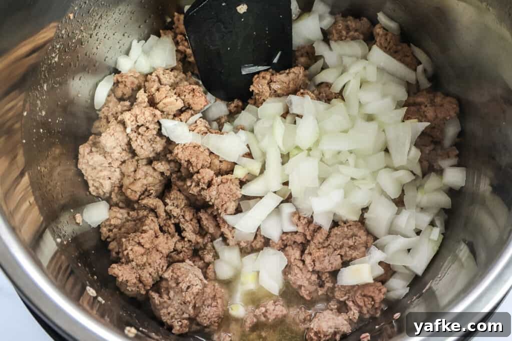 Cooking the ground turkey and onions on the saute function