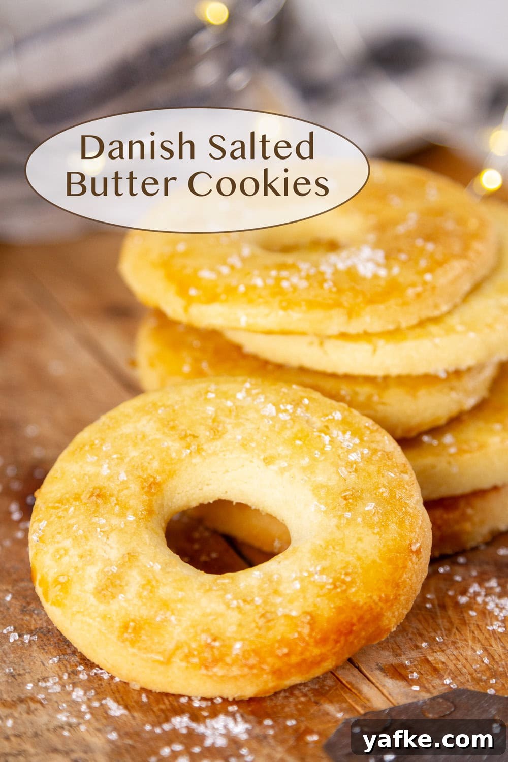 Classic Danish Salted Butter Cookies Recipe 2 A stack of Danish salted butter cookies, one tilted toward the viewer.