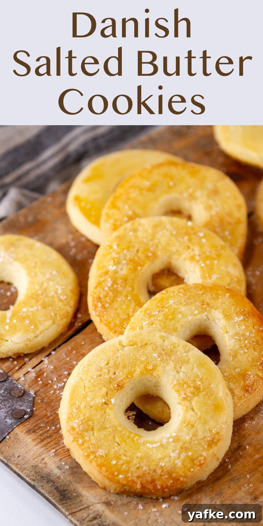 Classic Danish Salted Butter Cookies Recipe 11 Some cut out cookies on a wooden tray.