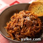 Classic Slow Cooker Italian American Meat Sauce Recipe 2 Close up of bowl of spaghetti and meat sauce.