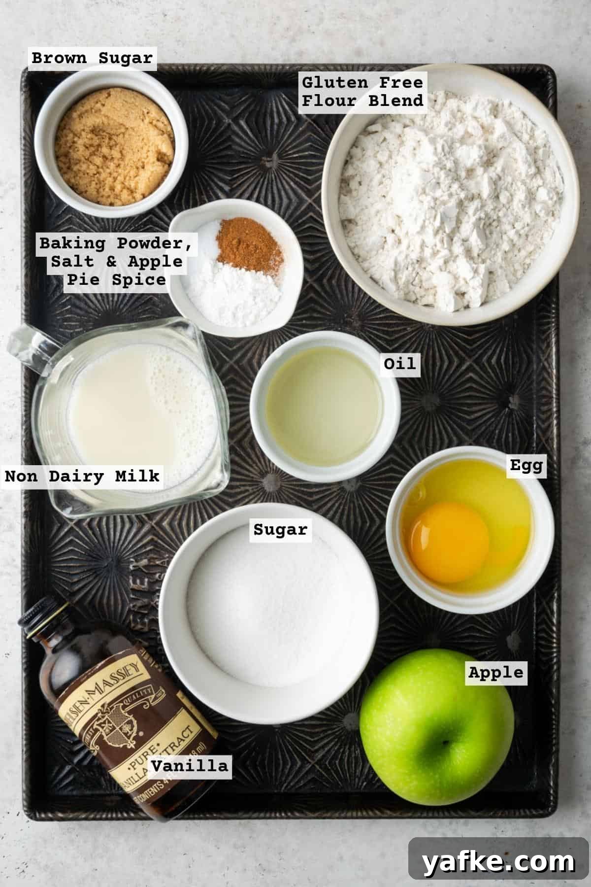 Gluten-Free Apple Cinnamon Muffins 3 Ingredients for gluten free apple muffins on a metal baking tray.