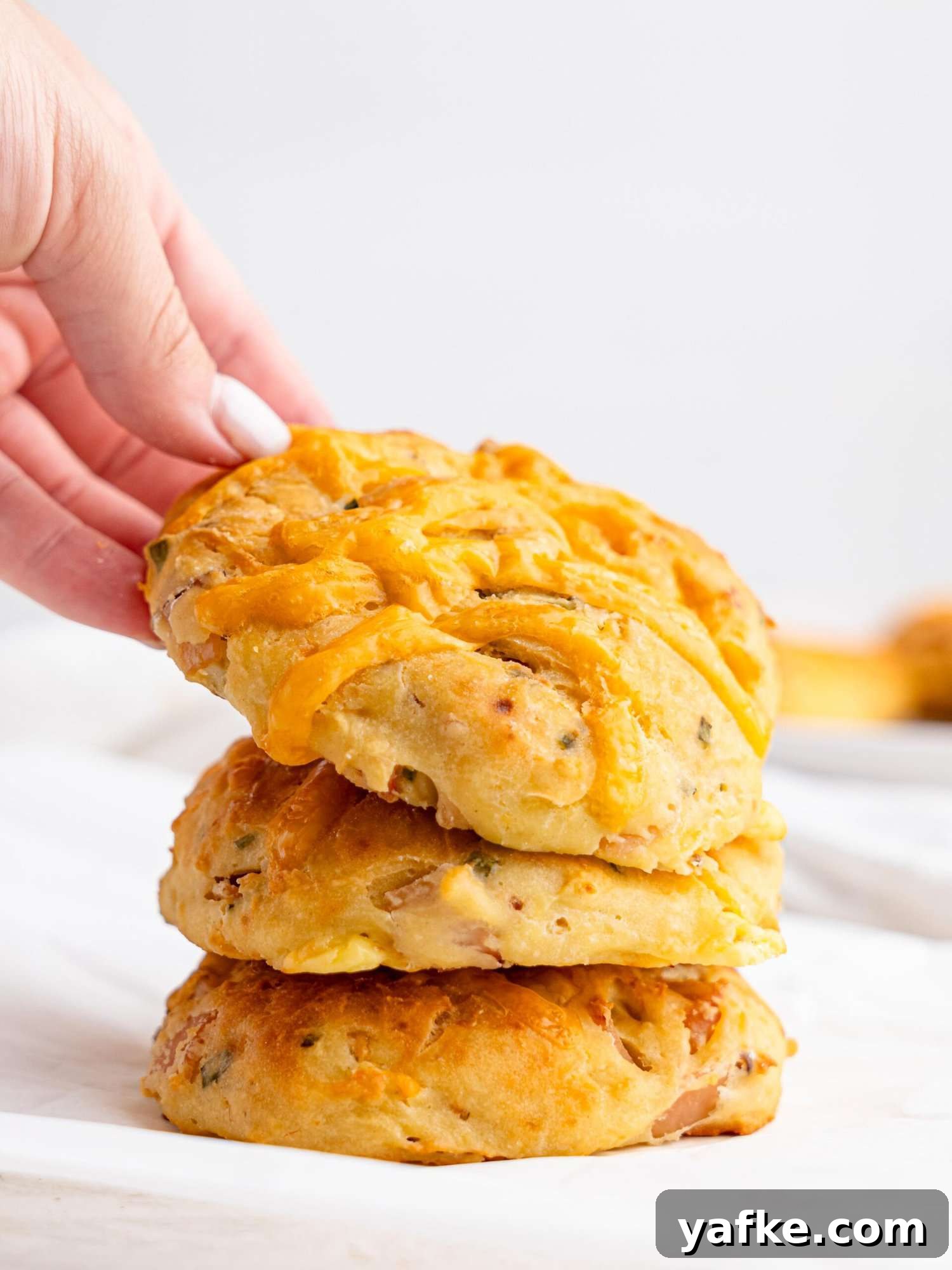 High-Protein Butter-Free Biscuits Recipe 12 Three protein biscuits stacked on top of each other.