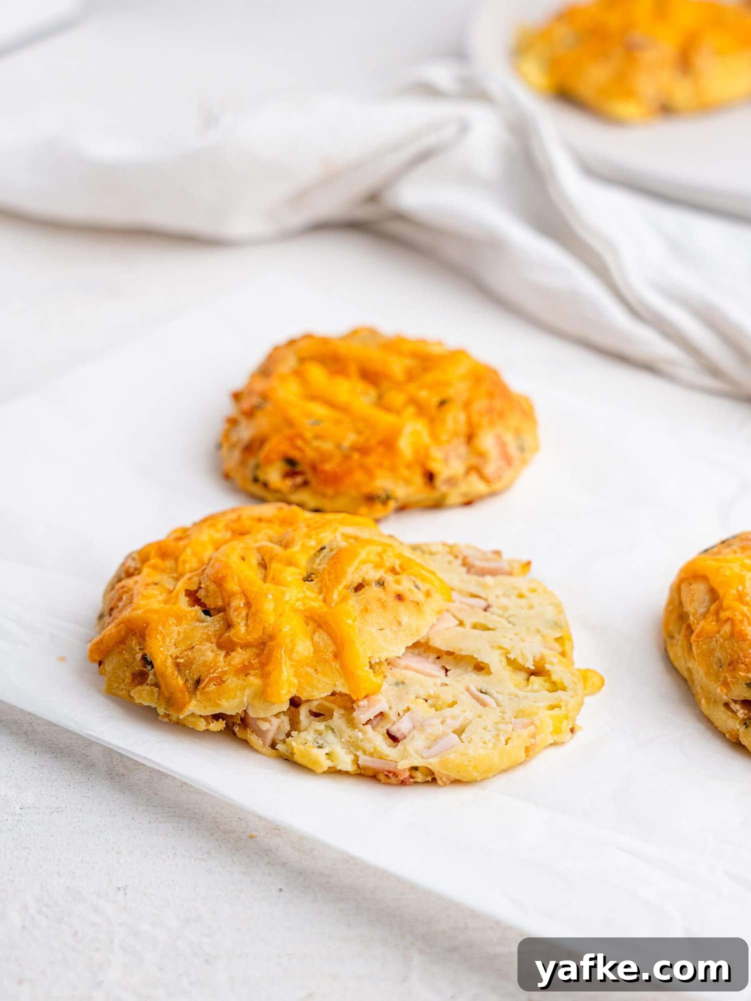 High-Protein Butter-Free Biscuits Recipe 14 A ham and cheese biscuit cut in half.