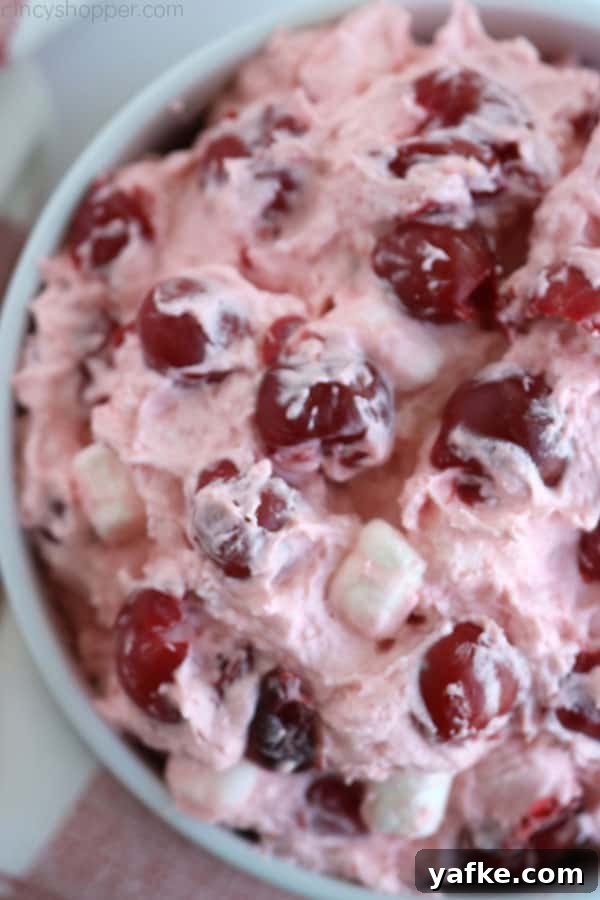 Cherry Fluff Salad in a white bowl.