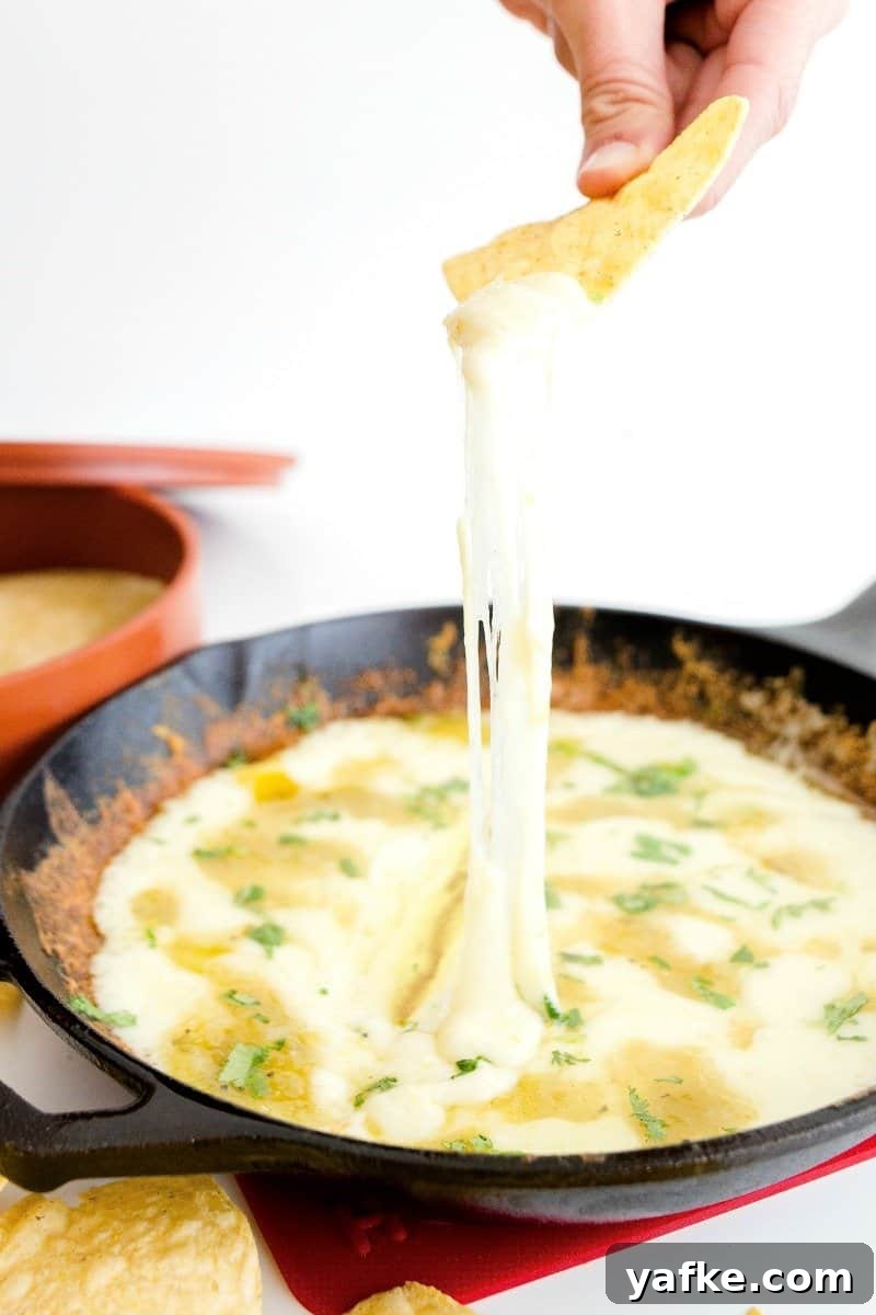 Skillet Queso Fundido: Gooey Melted Cheese Dip Recipe 4 Slices of Manchego and Monterey Jack ready to be shredded